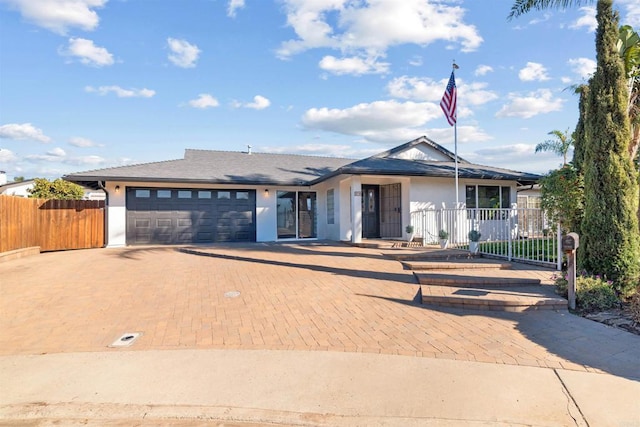 single story home with a garage