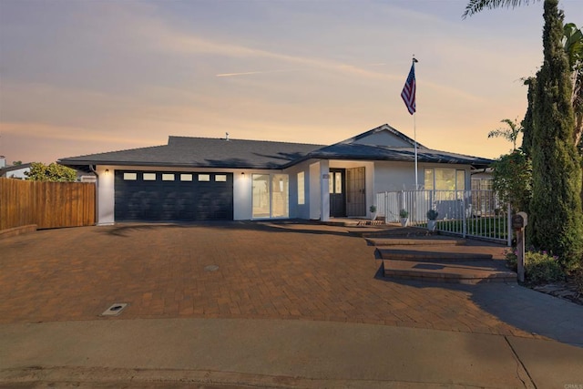 view of front of property with a garage