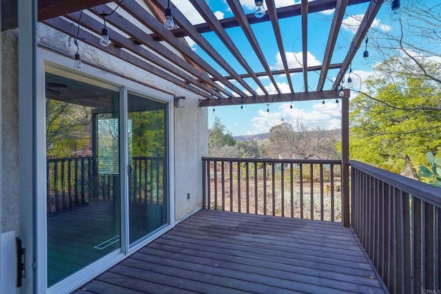 wooden deck with a pergola