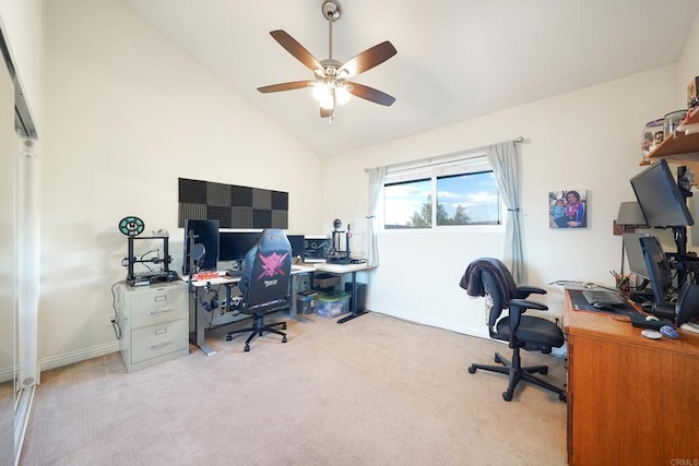 home office featuring ceiling fan, light colored carpet, and lofted ceiling