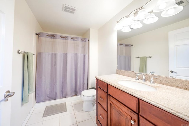 bathroom featuring toilet, vanity, tile patterned floors, and curtained shower