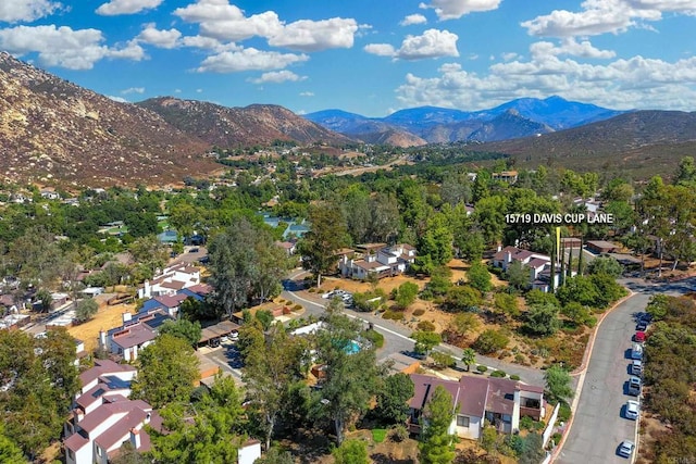 birds eye view of property featuring a mountain view