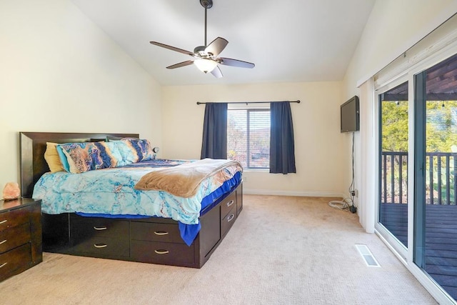 carpeted bedroom featuring ceiling fan, access to exterior, and vaulted ceiling