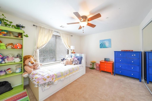 carpeted bedroom with ceiling fan