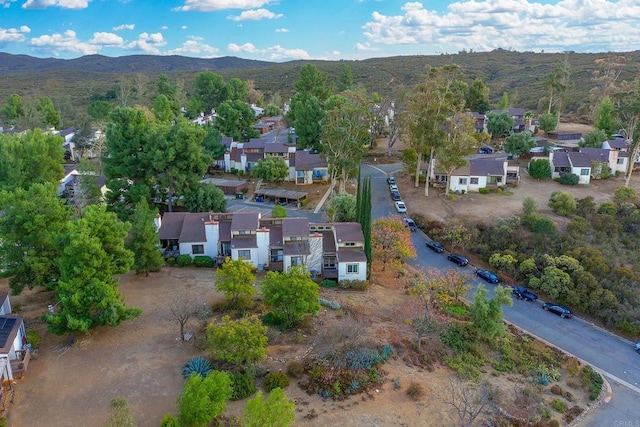 birds eye view of property with a mountain view