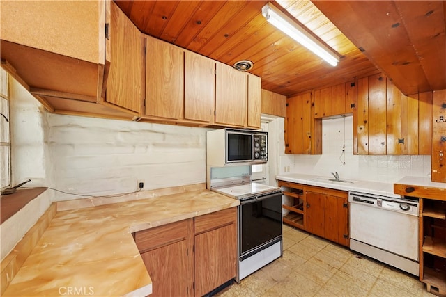 kitchen with white dishwasher, sink, butcher block counters, and range with electric cooktop