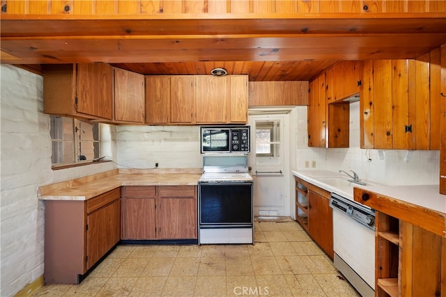 kitchen with sink and white appliances