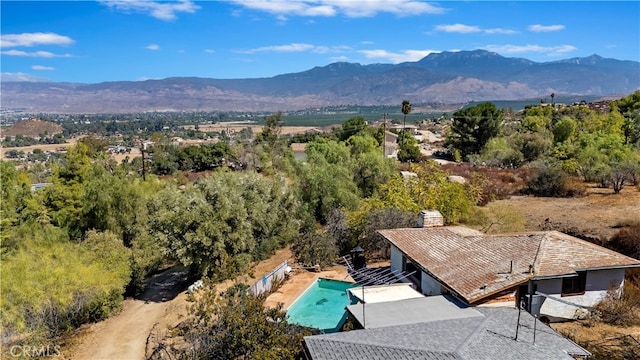 birds eye view of property with a mountain view