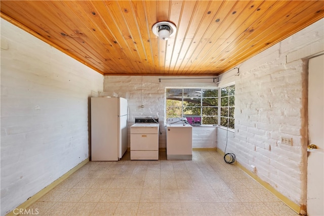 laundry room featuring independent washer and dryer and wood ceiling