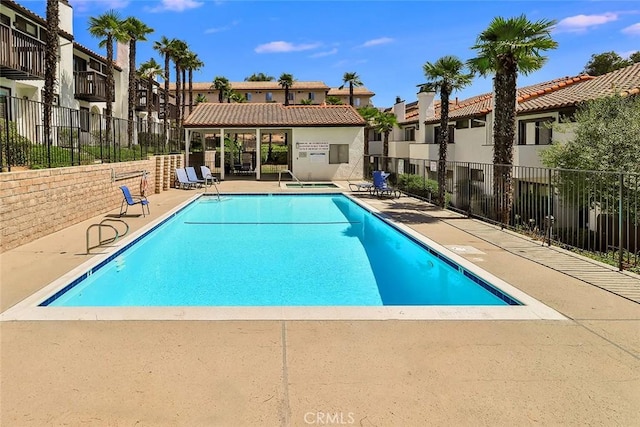 view of swimming pool with a patio