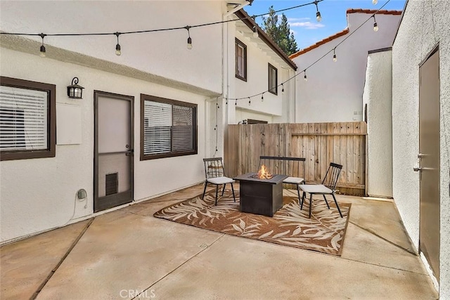 view of patio / terrace with an outdoor fire pit