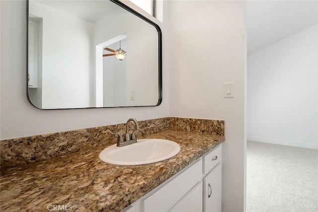 bathroom featuring ceiling fan and vanity