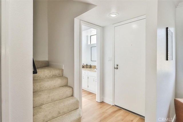 entryway with light hardwood / wood-style floors