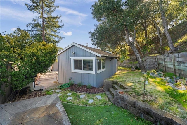 view of outdoor structure with a lawn