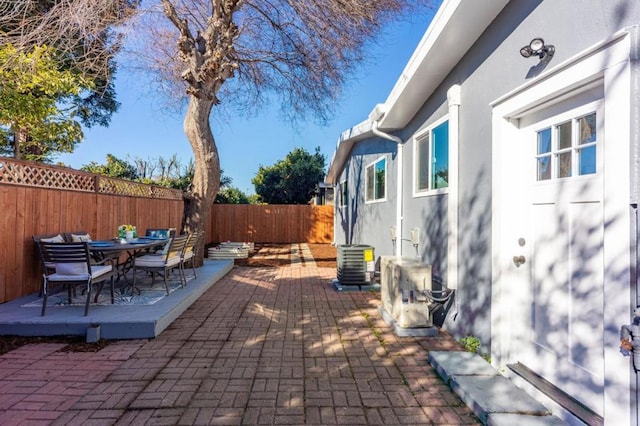 view of patio / terrace featuring ac unit and central AC unit