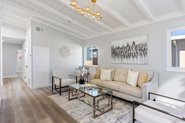 living room with wood ceiling, wood-type flooring, a chandelier, and vaulted ceiling with beams