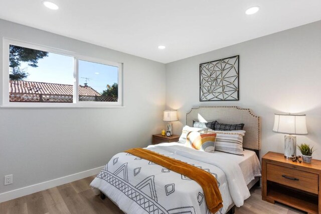 bedroom with wood-type flooring