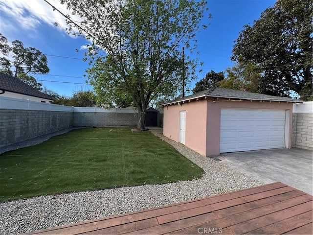 view of yard featuring an outbuilding and a garage