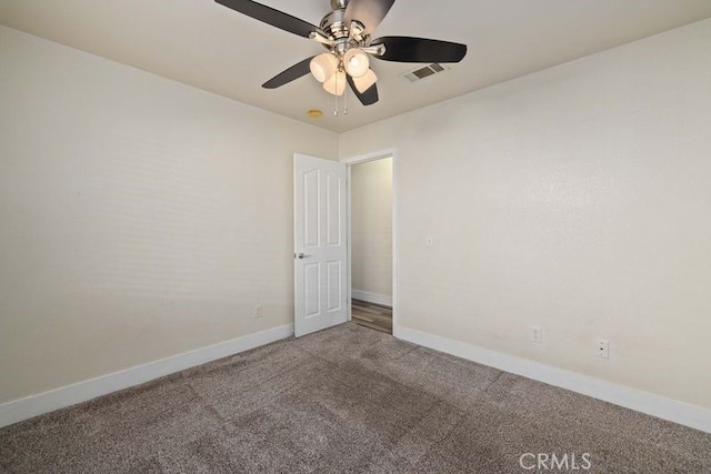 carpeted empty room with ceiling fan