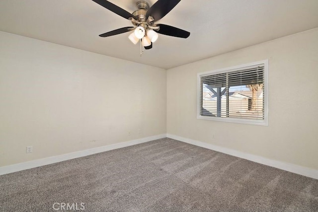 empty room with ceiling fan and carpet flooring