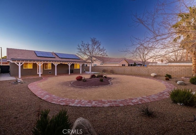 view of yard at dusk