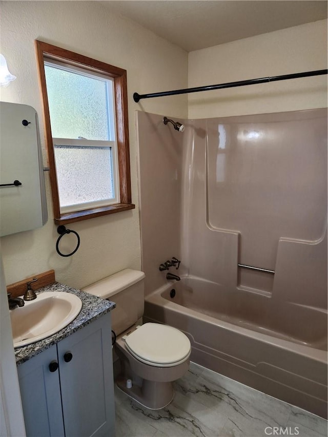 full bathroom featuring toilet, bathtub / shower combination, and vanity