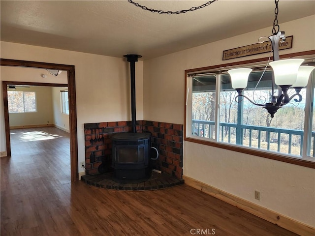 living room with a wood stove and dark hardwood / wood-style floors