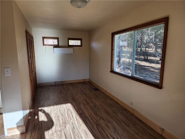 unfurnished room featuring dark wood-type flooring
