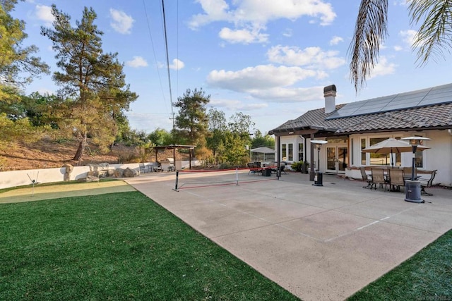 view of patio / terrace with tennis court