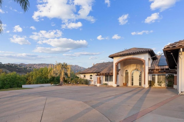 mediterranean / spanish house with a mountain view