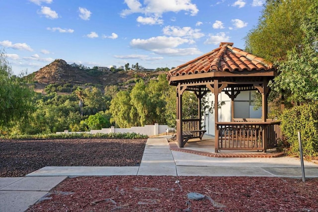 view of community with a gazebo and a mountain view