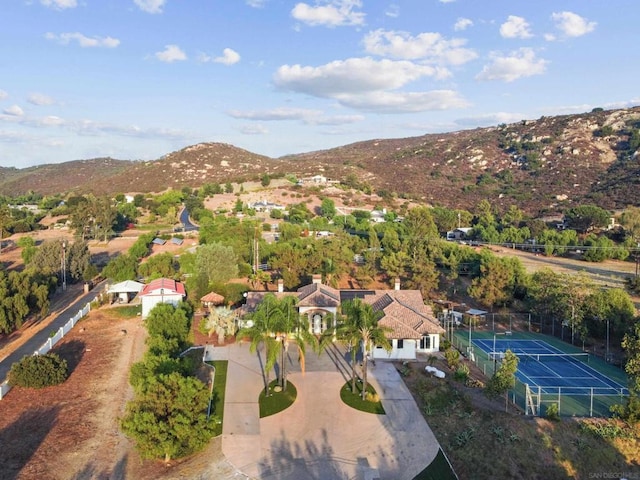 birds eye view of property with a mountain view