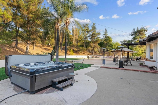 view of patio with a hot tub