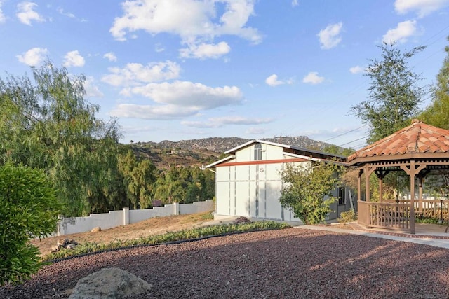 view of yard featuring a gazebo and a mountain view