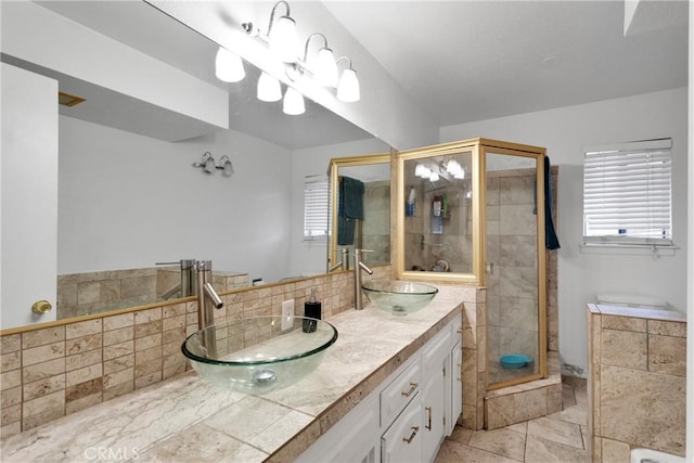 bathroom with vanity, tile patterned floors, and tiled shower