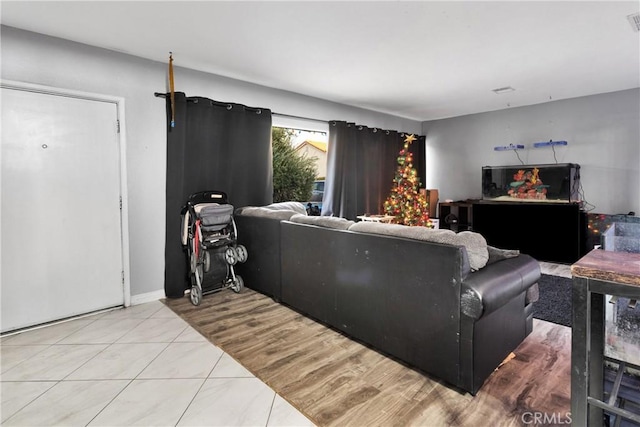 living room featuring light tile patterned flooring