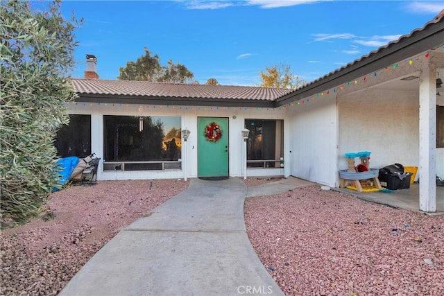 doorway to property featuring a patio area