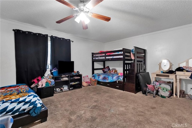 carpeted bedroom featuring ceiling fan, a textured ceiling, and ornamental molding