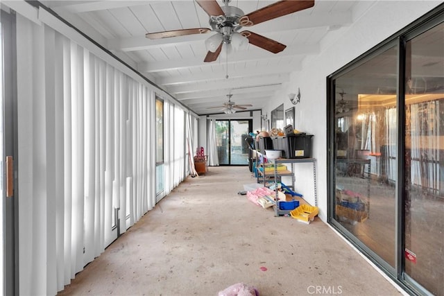 unfurnished sunroom with ceiling fan and vaulted ceiling with beams