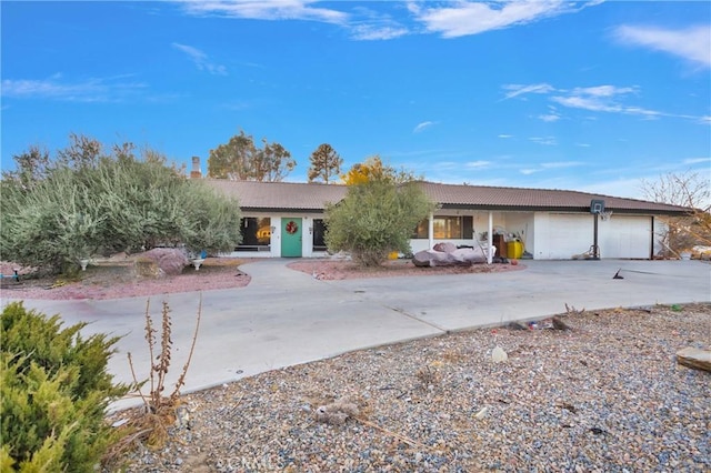 ranch-style house featuring a garage