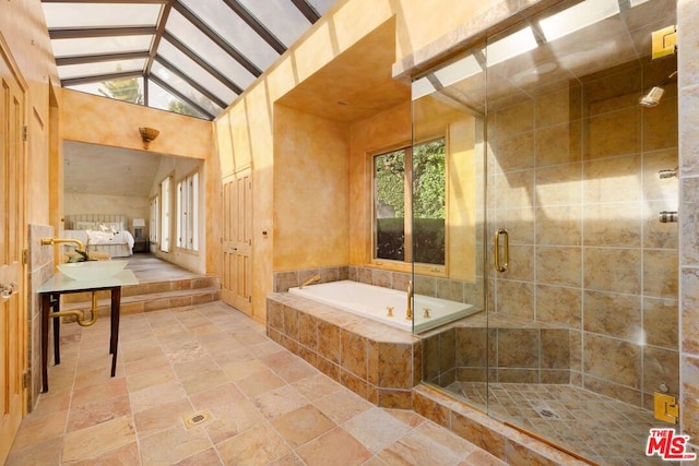 bathroom with beamed ceiling, high vaulted ceiling, and independent shower and bath