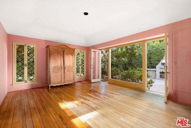 interior space featuring french doors and light hardwood / wood-style floors