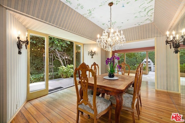 dining area featuring a chandelier and light hardwood / wood-style floors