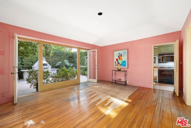 unfurnished living room featuring light wood-type flooring