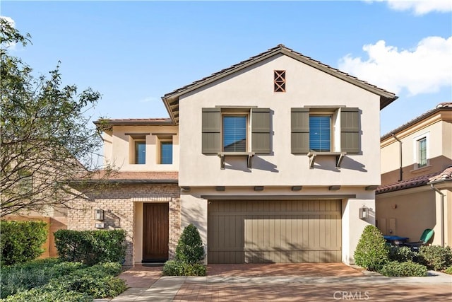 view of front of home with a garage