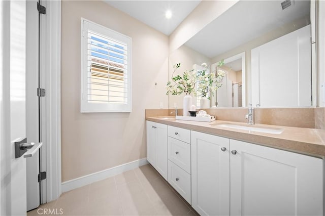 bathroom featuring tile patterned floors and vanity