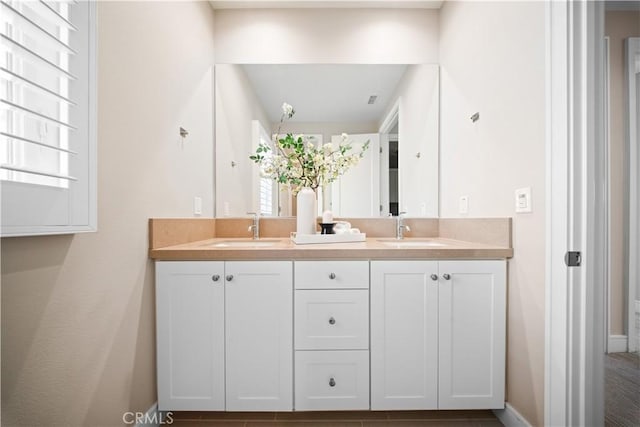 bathroom featuring plenty of natural light and vanity