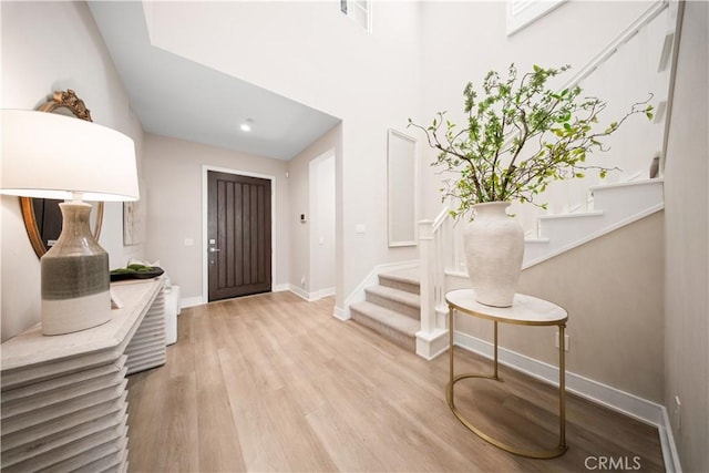 entryway with light hardwood / wood-style flooring