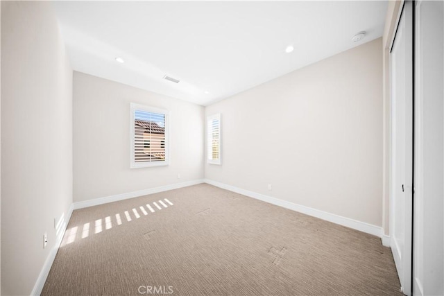 unfurnished bedroom with a closet and carpet flooring