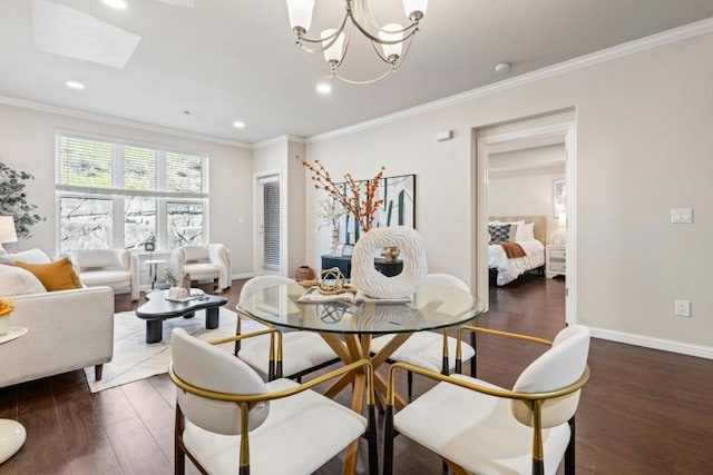 dining area with ornamental molding, dark hardwood / wood-style floors, and a notable chandelier